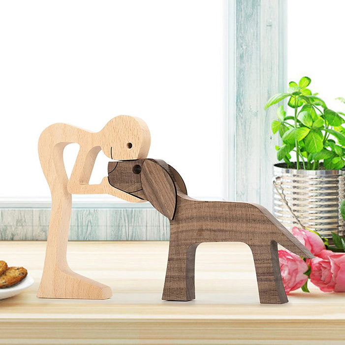 A Man And Black Floppy Ears Dog Wood Sculpture