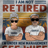 Two cartoon characters wearing sunglasses with text 'I AM NOT RETIRED, I'M UNDER NEW MANAGEMENT SEE WIFE' on a colorful background.