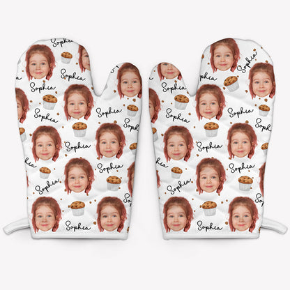 A pair of white oven mitts customized with a photo and the name 'Sophia' printed repeatedly.