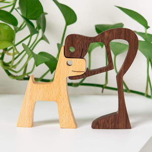 A Man And Dog With Pointy Ears Wood Sculpture