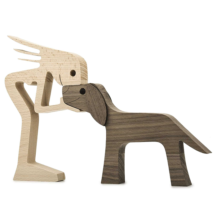A Woman And Black Floppy Ears Dog Wood Sculpture